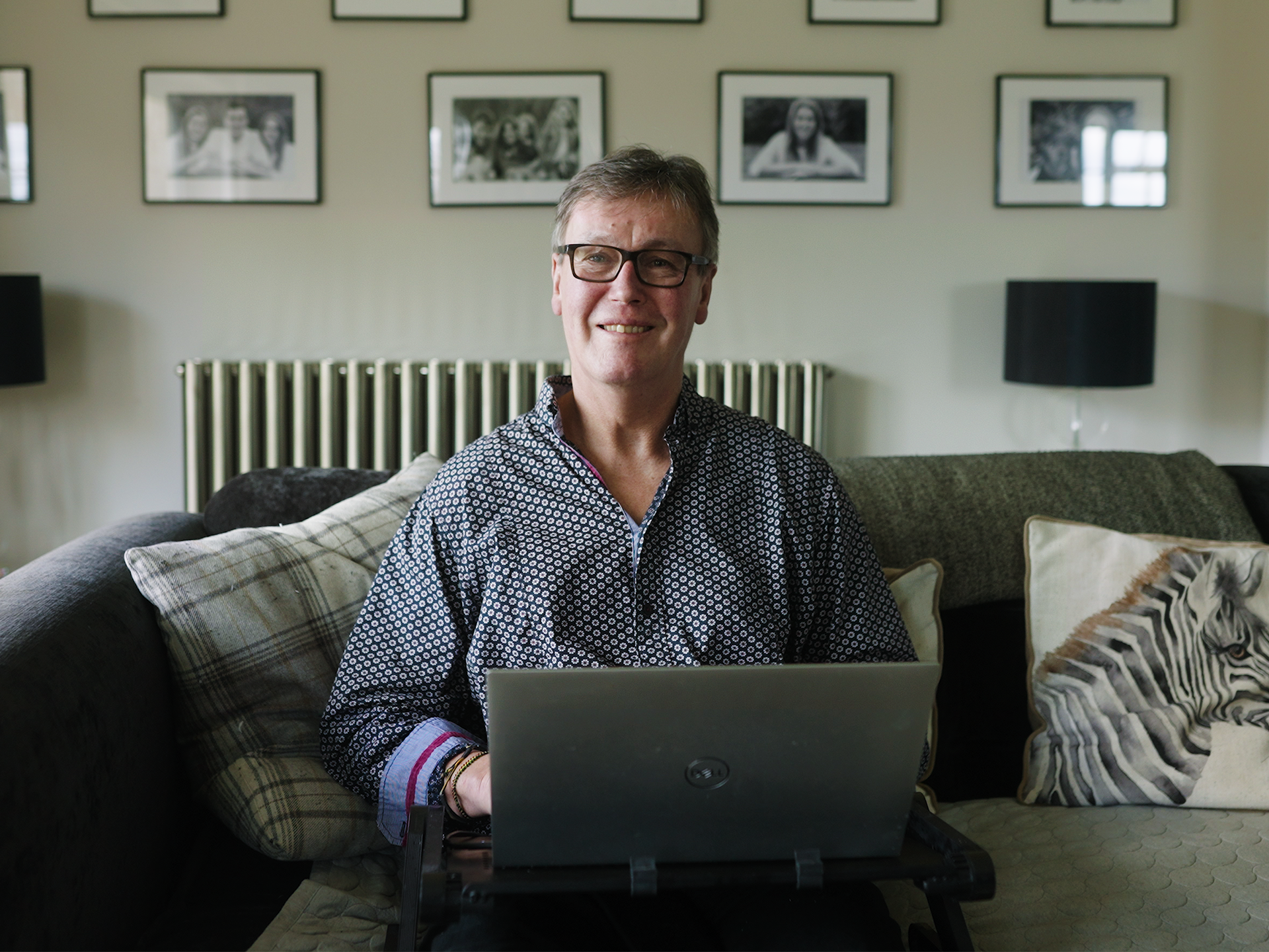 Honouring Loved Ones with Meaningful Celebration of Life Ideas 19 Paul smiling at laptop