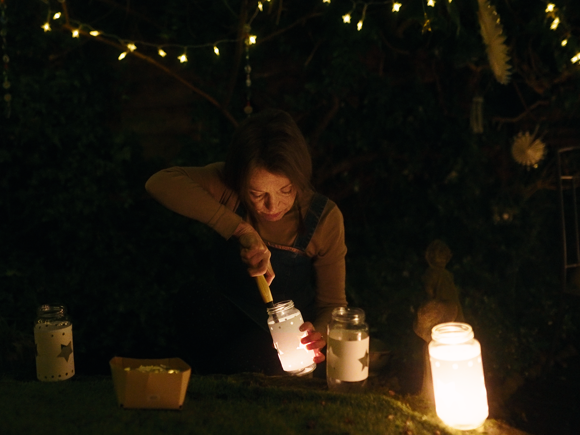 Woman lighting candles