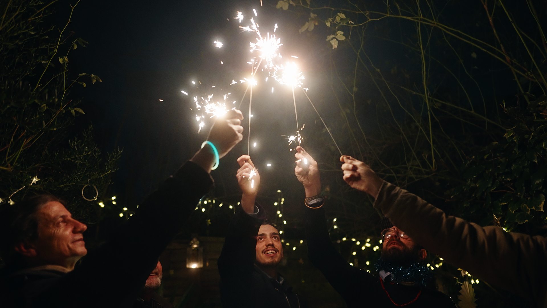 Family holding sparklers