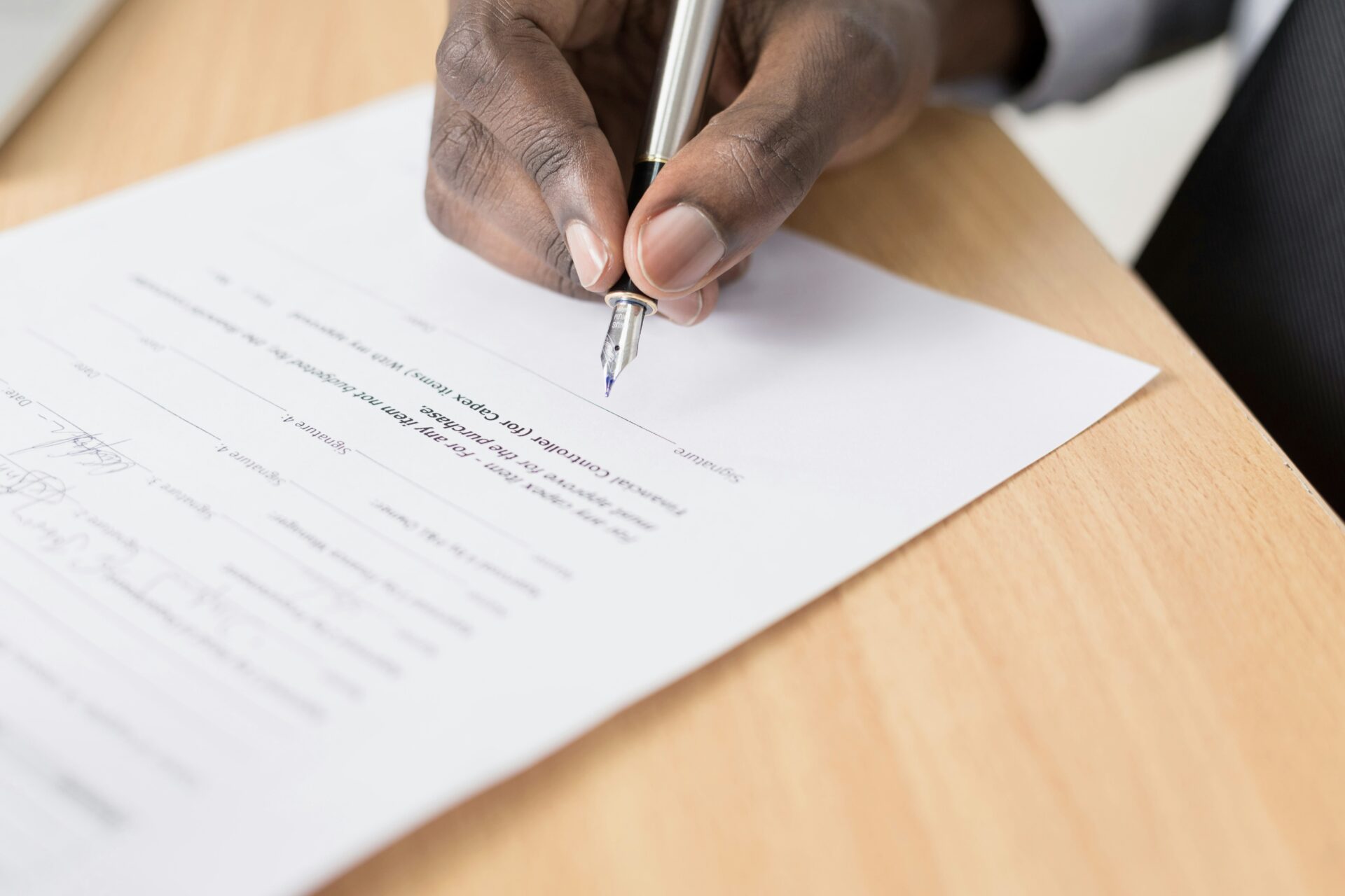 Man signing a document