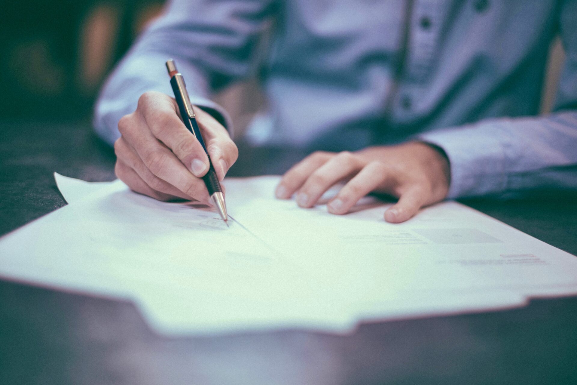 Man signing document