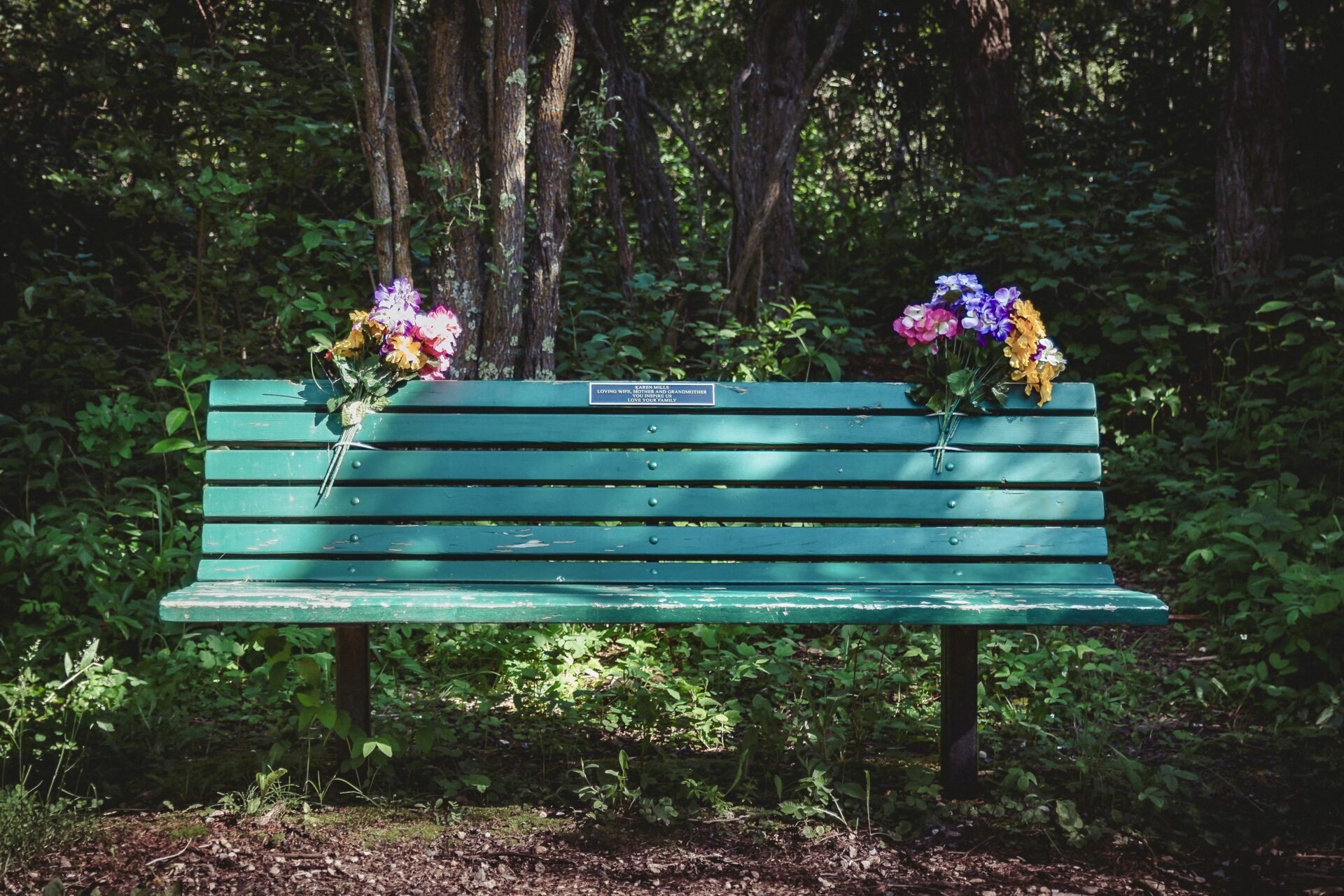 Memorial bench with flowers