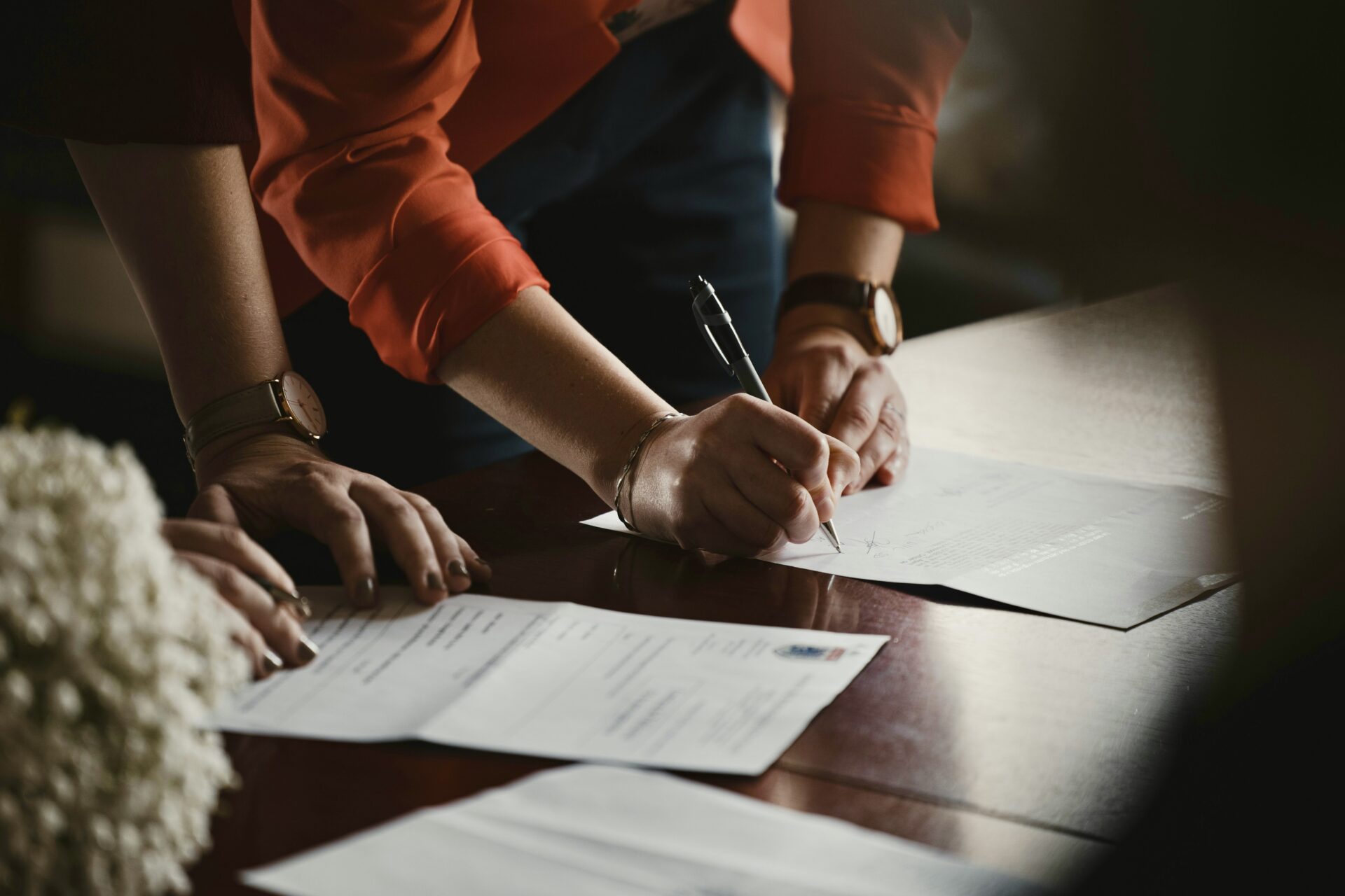 Person filling out documents