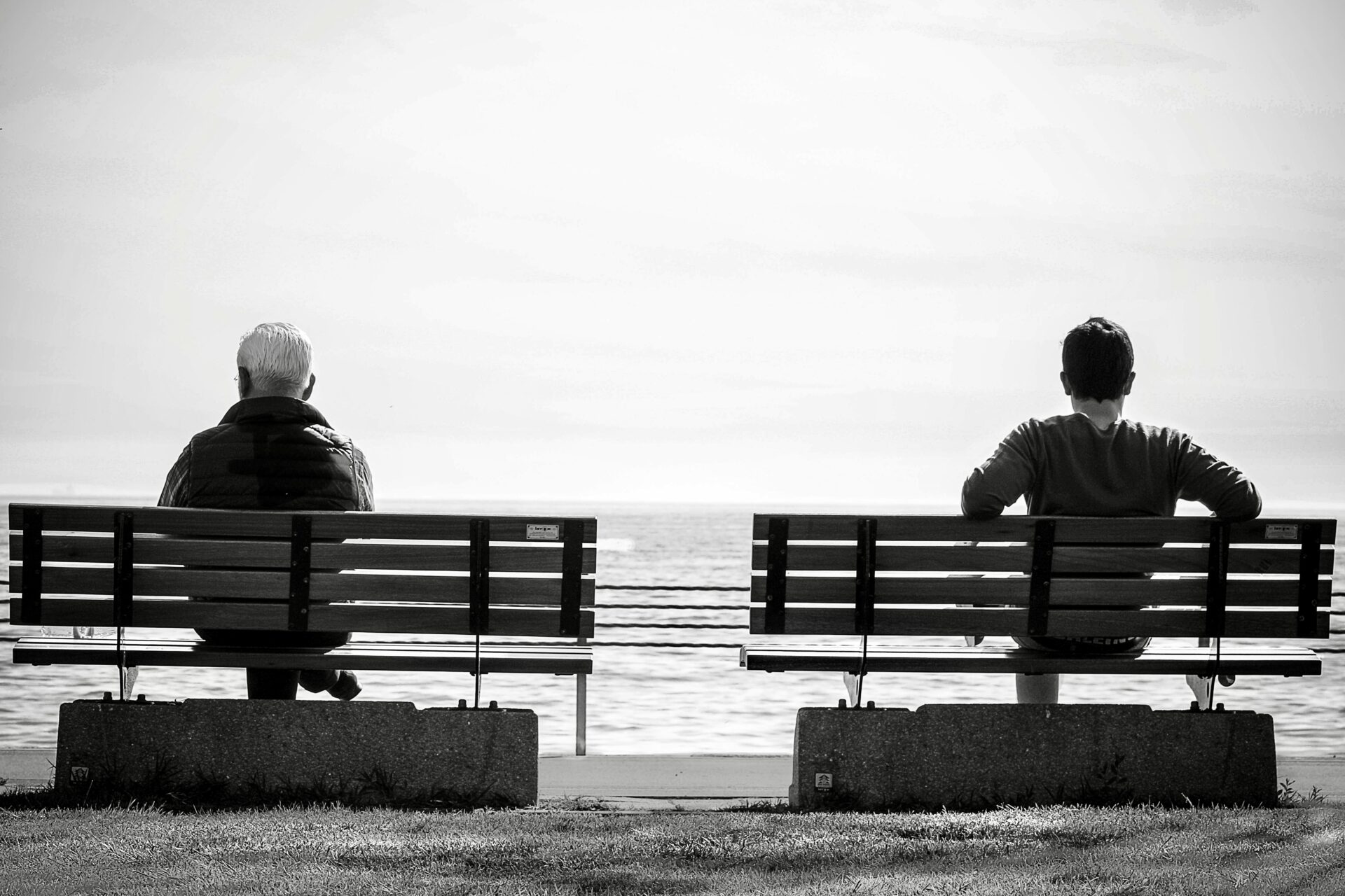 Guys waiting on a bench