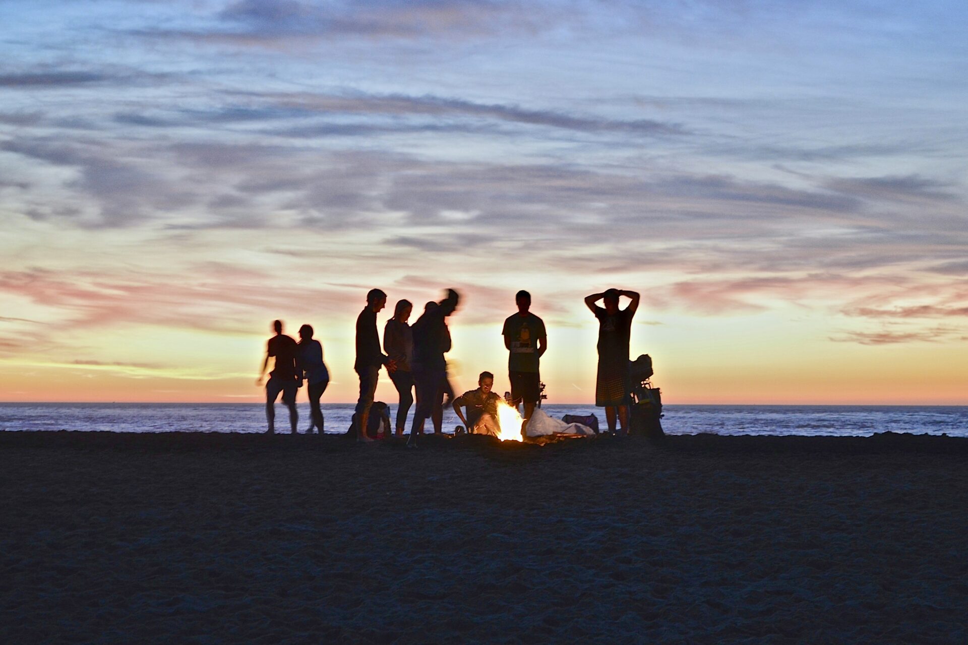 People having bonfire on beach