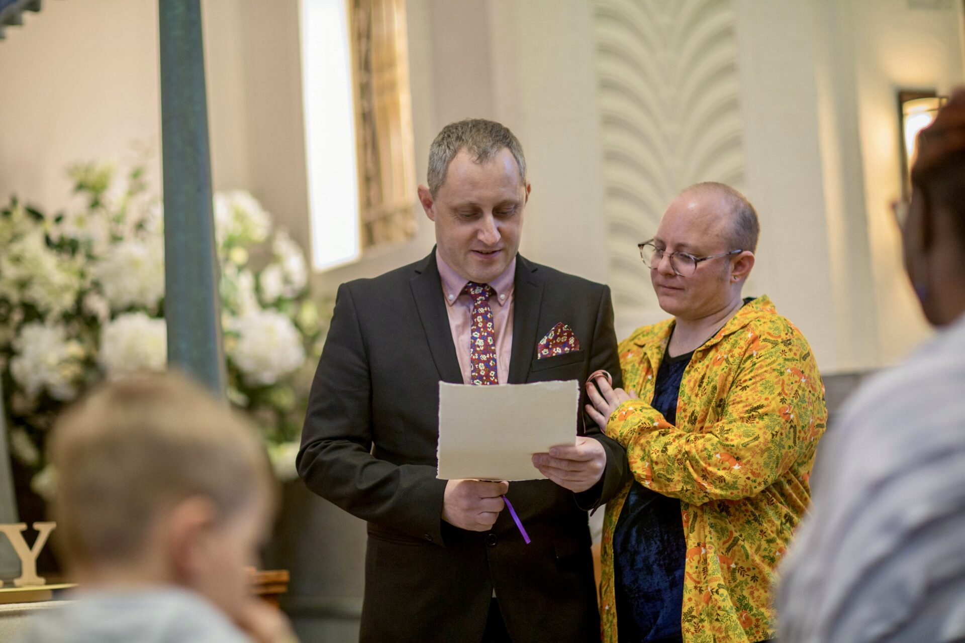 People speaking at funeral