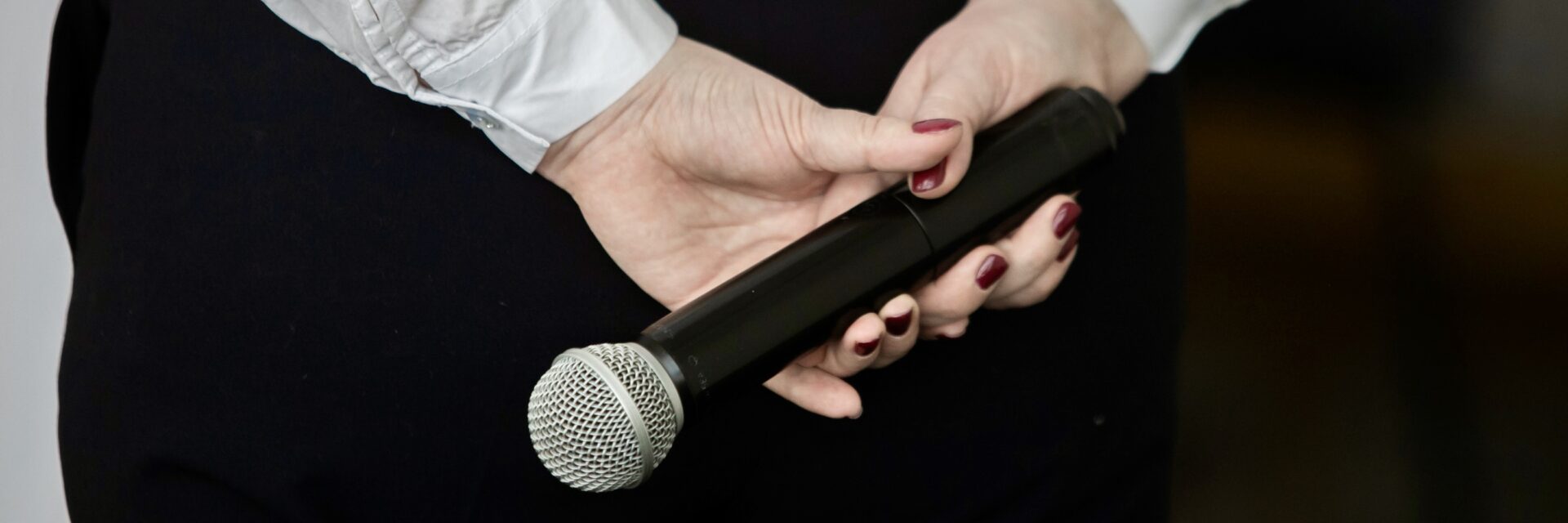 Person holding microphone