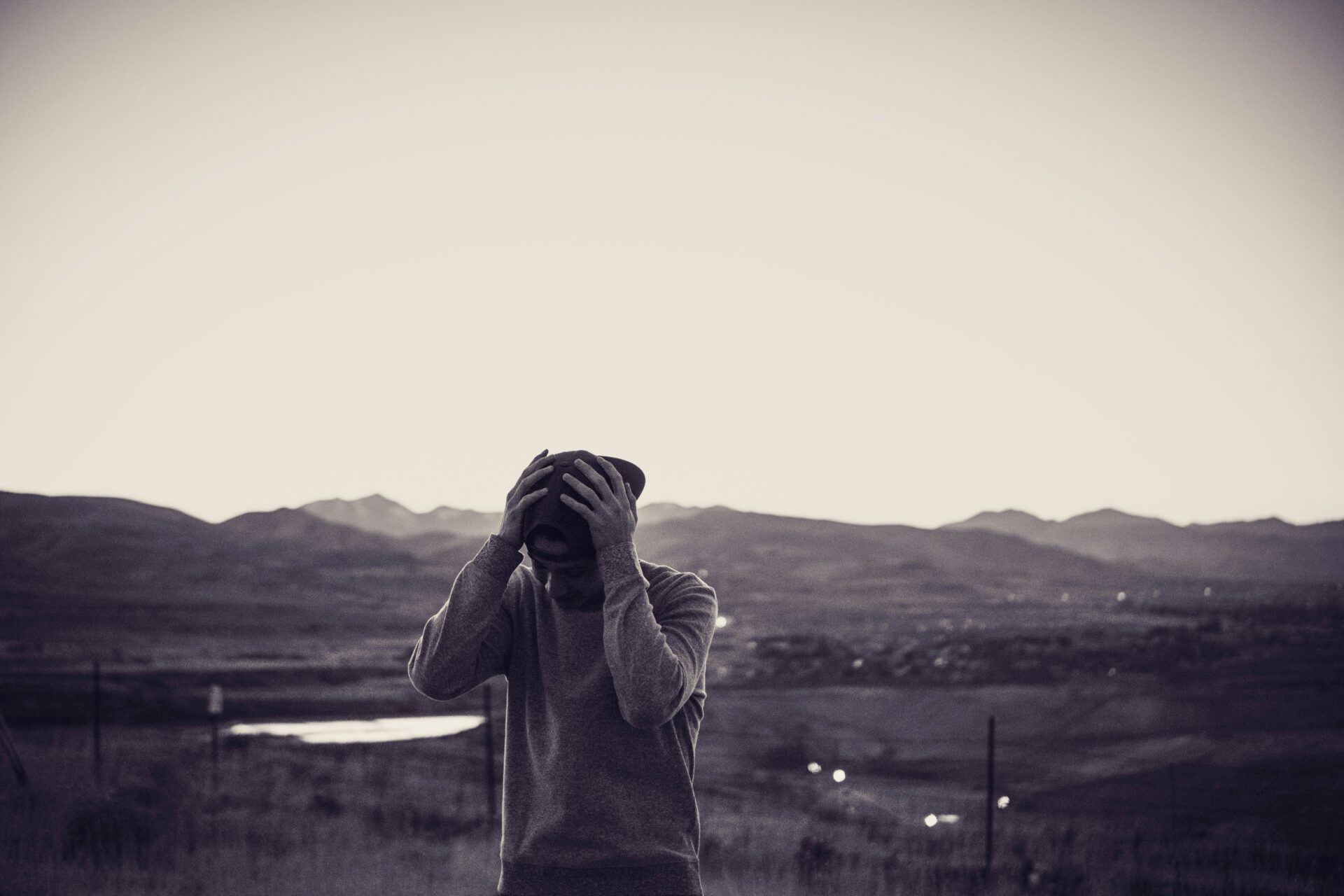 Person grieving outside bw