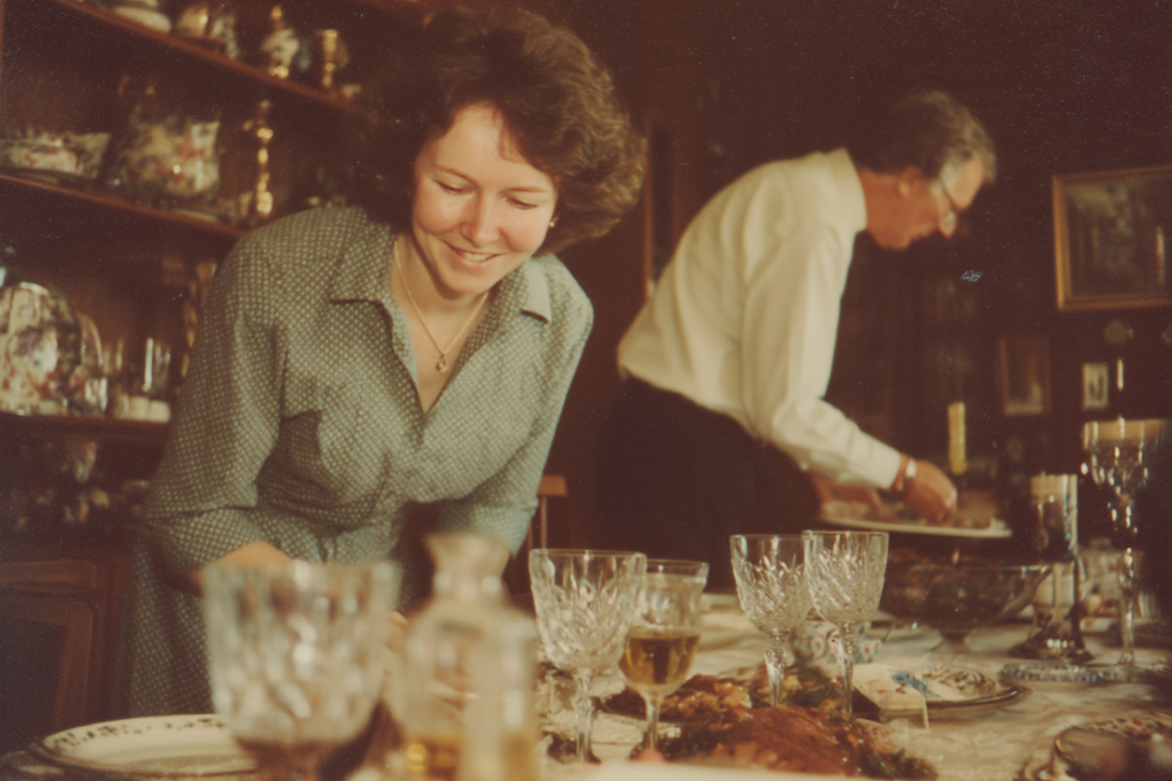 Old couple setting table