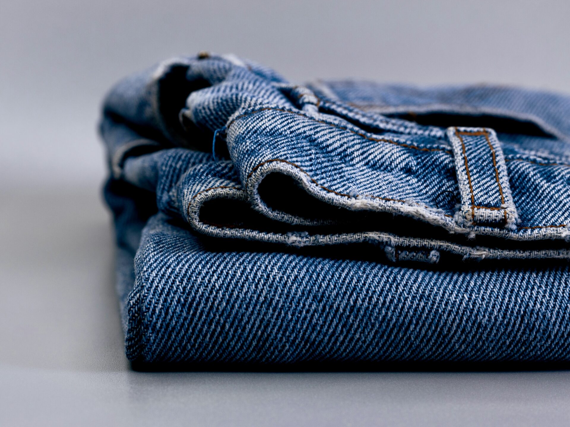 Jeans laying on surface